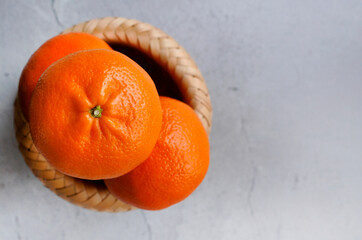 Stylish Mandarin Orange or Tangerinesa arrangement art, vivid color of tropical citrus fruits, prop...