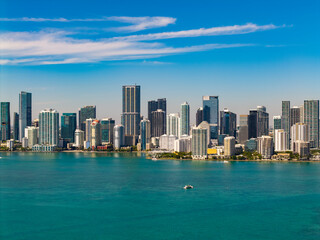 Fototapeta premium Brickell skyline with skyscraper architecture. City skyline. Waterfront city. Miami from Brickell Key in Florida. Skyscraper in downtown city. Cityscape skyline. Brickell building in Miami downtown