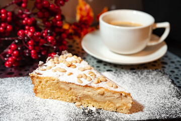 Slice of Italian pine nut tart with coffee.