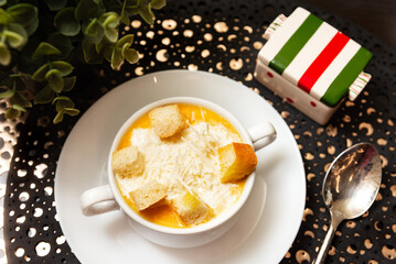 Pumpkin soup with croutons and parmesan.