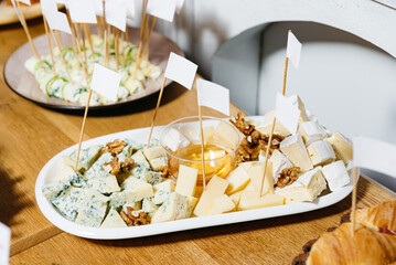 Cheese platter with honey and walnuts.