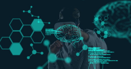 Image of human brains spinning and data processing over businessman wearing vr headset