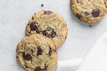 Overhead view of chocolate chip cookies, top view of homemade chocolate chip cookies on a white background