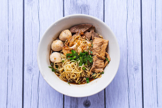 spicy thai pork noodle, boat Noodle, "Kuay Tiew Rua" with pork rind and pork Crackling
