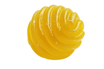 Swirling lemon gelatin creation on a pristine white background delights the senses