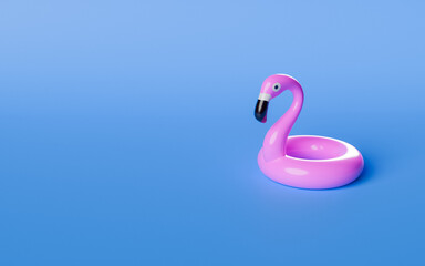 Pink inflatable flamingo sitting on blue background