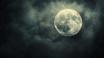 Full moon behind dark clouds, night sky, spooky atmosphere, Halloween backdrop