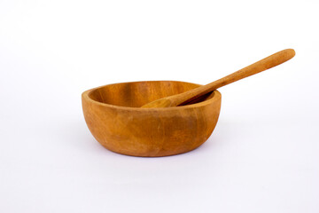 Group of wooden utensils on white background. Wooden utensils offer several benefits, including being gentle on cookware, non-reactive with food, heat-resistant, and environmentally friendly.