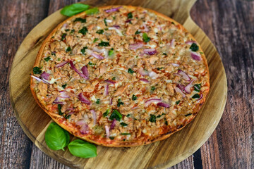 High protein low carb pizza with tuna onion and vegetables.
 Ketogenic diet food 