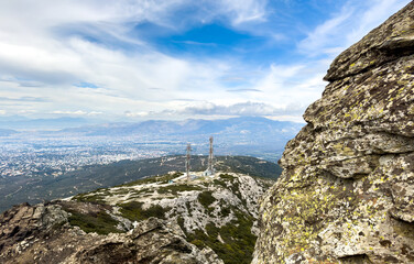 Communication Towers with satellite dishes on mount Penteli, Athens city aerial view, Greece