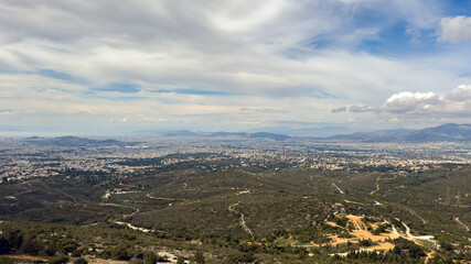 Greece. Aerial view of Athens city from Penteli mount, cloudy blue sky