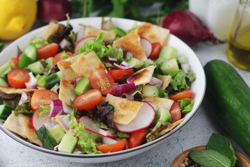 A bowl with Fattoush - Traditional Levantine salad	