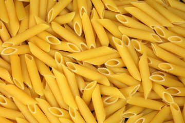 penne makarna - uncooked italian penne pasta background