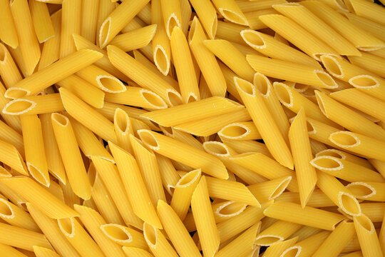 penne makarna - uncooked italian penne pasta background