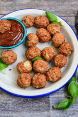 Mini pork meatballs with salsa filling.
 Party fingerfood. Diet  ketogenic food.