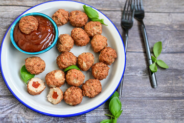 Mini pork meatballs with salsa filling.
 Party fingerfood. Diet  ketogenic food.