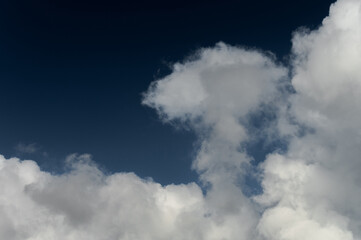 Cloud that is in the blue sky. Close-up of the serene sky above