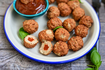 Mini pork meatballs with salsa filling.
 Party fingerfood. Diet  ketogenic food.