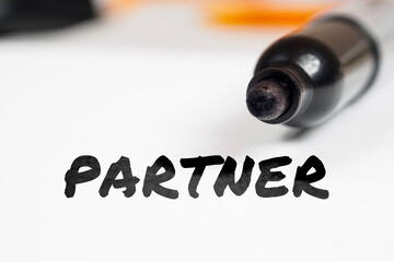 partner text on paper marker background