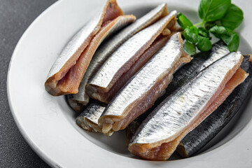 Sardines salted fish gourmet food background on the table rustic food top view copy space vegetarian food
