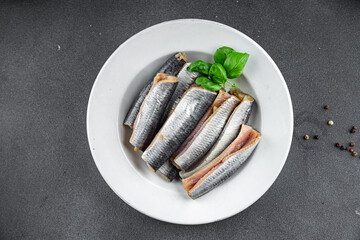 Sardines salted fish gourmet food background on the table rustic food top view copy space vegetarian food