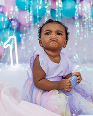 Beautiful baby, black girl, dressed as a princess celebrating her 1st birthday on a beautiful...