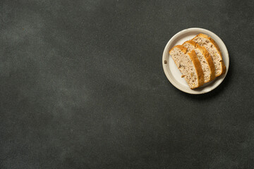 Simple toast with marmalade on dark minimal background.