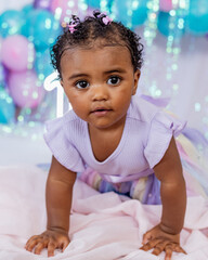 Beautiful baby, black girl, dressed as a princess celebrating her 1st birthday on a beautiful...