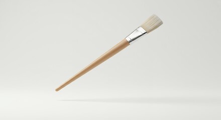 Fototapeta premium A Clean Aesthetic: Close-up of a Wooden Paintbrush on Neutral Backdrop