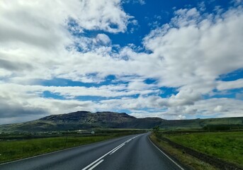 Driving through Iceland countryside under a cloudy sky