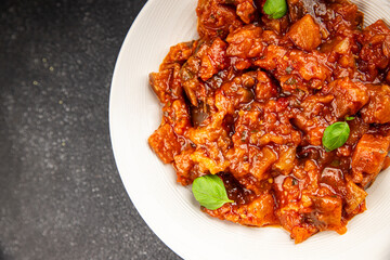 Eggplant stew vegetable dish salad tasty fresh gourmet food background on table rustic food top view copy space