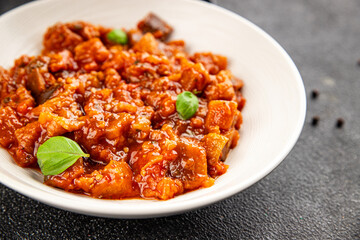 Eggplant stew vegetable dish salad tasty fresh gourmet food background on table rustic food top view copy space