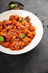 Eggplant stew vegetable dish salad tasty fresh gourmet food background on table rustic food top view copy space
