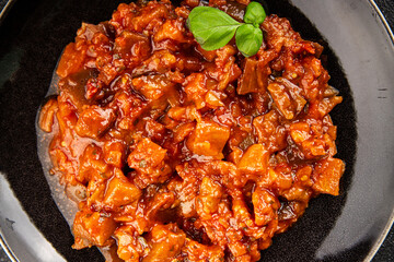 Eggplant stew vegetable dish salad tasty fresh gourmet food background on table rustic food top view copy space