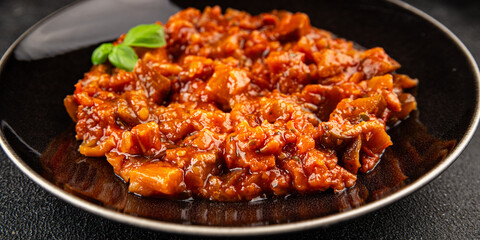 Eggplant stew vegetable dish salad tasty fresh gourmet food background on table rustic food top view copy space