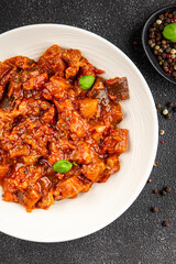 Eggplant stew vegetable dish salad tasty fresh gourmet food background on table rustic food top view copy space