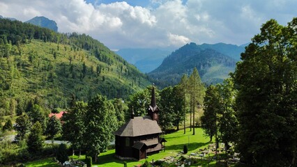 Stunning panoramic view of Church and Tatra mountains in Tatranska Javorina, Slovakia A picturesque...