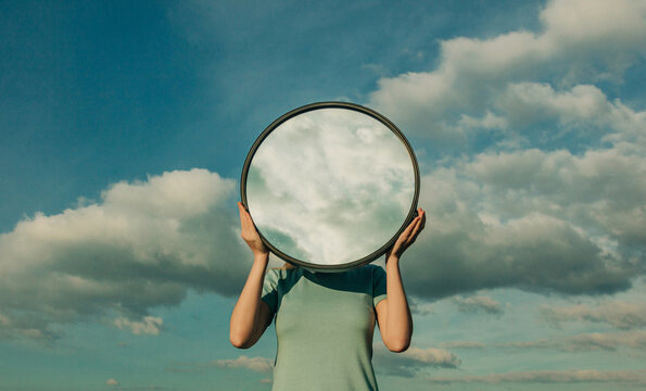 Surreal concept of reflection blending with cloudy sky