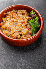 Eggplant dip aubergine salad Baba ganoush eggplant, tomato, onion vegetable dish fresh gourmet food background on table rustic food top view copy spac