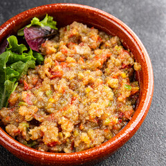 Eggplant dip aubergine salad Baba ganoush eggplant, tomato, onion vegetable dish fresh gourmet food background on table rustic food top view copy spac
