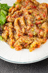 Eggplant dip aubergine salad Baba ganoush eggplant, tomato, onion vegetable dish fresh gourmet food background on table rustic food top view copy spac