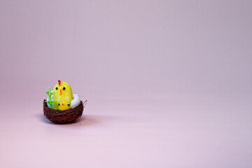 Doll hen with chicks in the nest