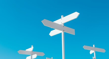 Multiple Directions Signposts - White signposts pointing in multiple directions against a vibrant blue sky. Concept of choices, options, and directions