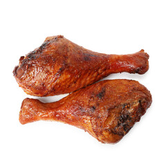 Delicious baked turkey drumsticks isolated on white, top view