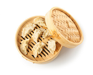 Tasty boiled gyoza (dumplings) in bamboo steamer isolated on white, top view