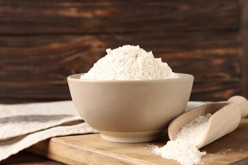 Brown rice flour on wooden table, closeup
