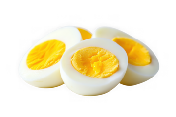 Perfectly boiled eggs, showcasing vibrant yellow yolks and pristine white whites against a bright white background.