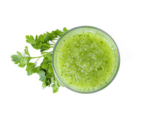 Healthy parsley smoothie in glass and leaves isolated on white, top view