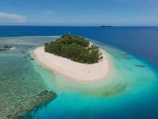 Lampu Island, Gorontalo - Indonesia: Aerial view of beautiful tropical island with white sand beach and turquoise sea 