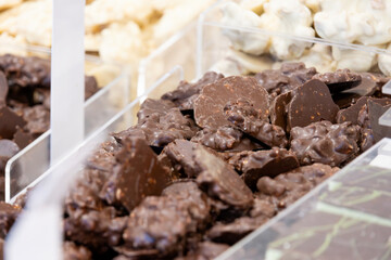 Small flat chocolates in a container